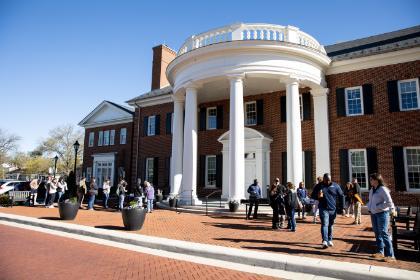 Prospective students and their families gathering outside Radcliff Hall