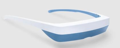 Luminette glasses - White and light blue wearable device resembling a pair of glasses without lenses. The frame has a smooth, curved design with a thick front section. Set against a neutral gray background with soft shadowing beneath. Appears to be a modern headset