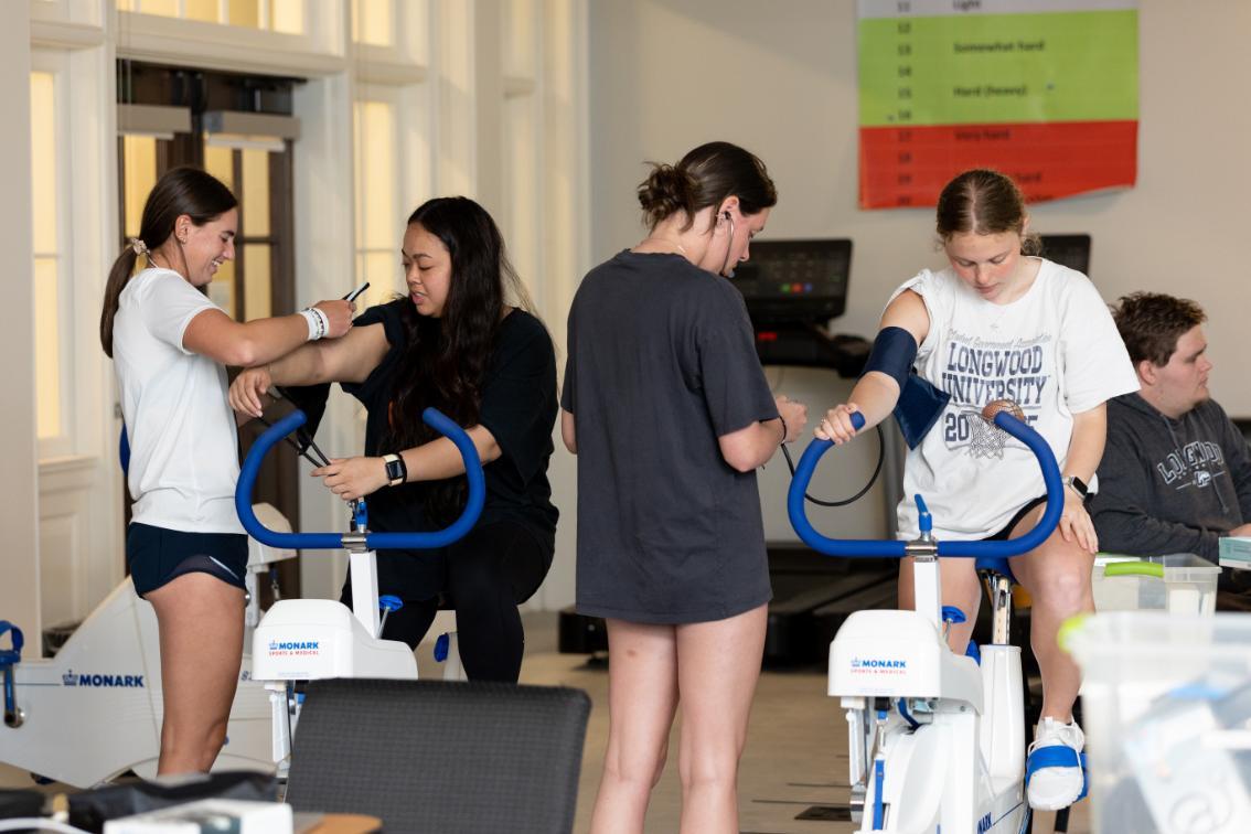 Longwood kinesiology students conduct exercise testing on stationary bikes