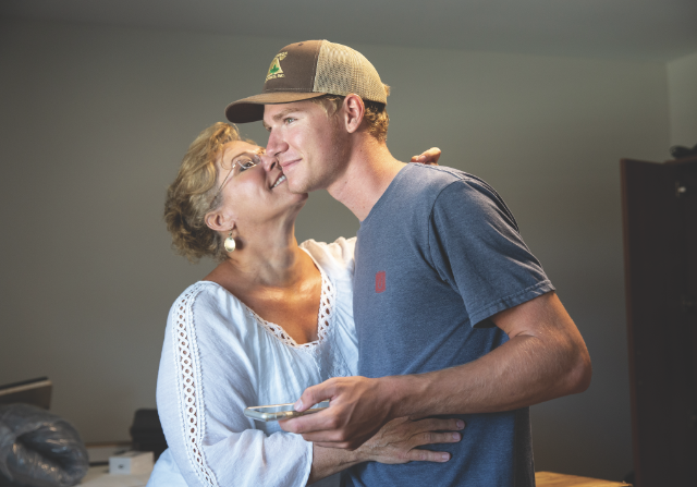 Mother kissing son