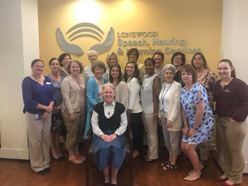 Mrs. Kathy Charleston -seated-  was recently awarded the Friend of Longwood’s Communication Sciences and Disorders