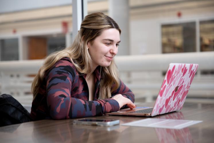 Student studying with a laptop -