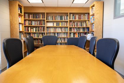 Chairs, Table, and stand full of books