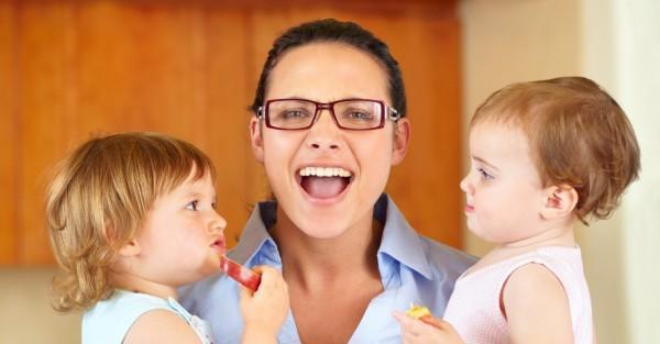 Mom holding two kids