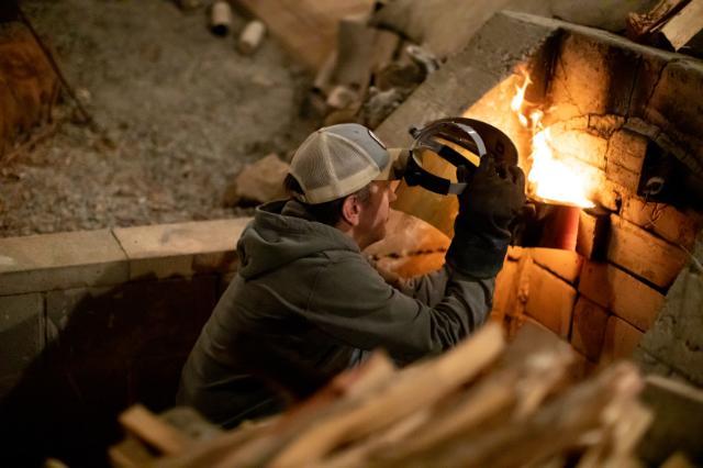 Person tending to the kiln