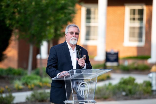 Dr. Ken Perkins speaking at a retirement celebration held in his honor last month