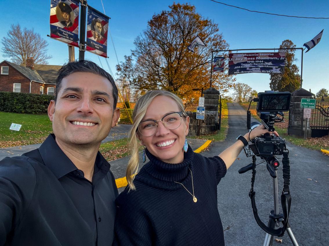 Amy and Chris Perez stand behind their camera