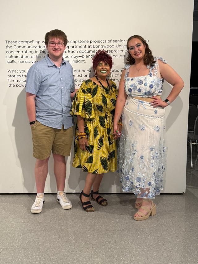 Braden Hamilton '26 (left) and Isabella McCullough '26 (right) stand with Dr. Yemaja Jubilee (center) after working to share Dr. Jubilee's story in their Emmy-winning documentary