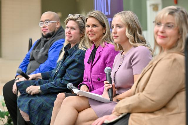 Fentanyl awareness event panelists listen on as an audience member asks a question