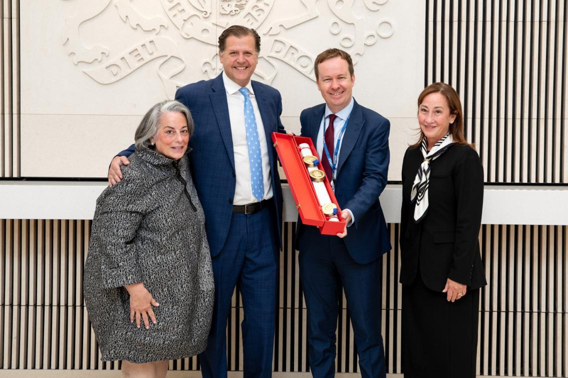 Embassy Counsellor Colin McDonald (second from right) presents Longwood’s official coat of arms and armorial bearings to former rectors of the Board of Visitors Pia Trigiani (left), Marianne Radcliff ’92 (right), and President W. Taylor Reveley IV at the British Embassy in Washington, D.C. on June 16, 2026.